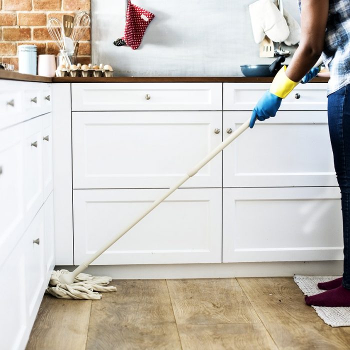 Woman mopping floor